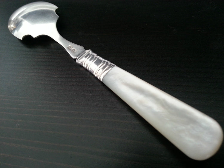 Antique silver plated dessert spoon ornamented with mother of pearl handle British Empire