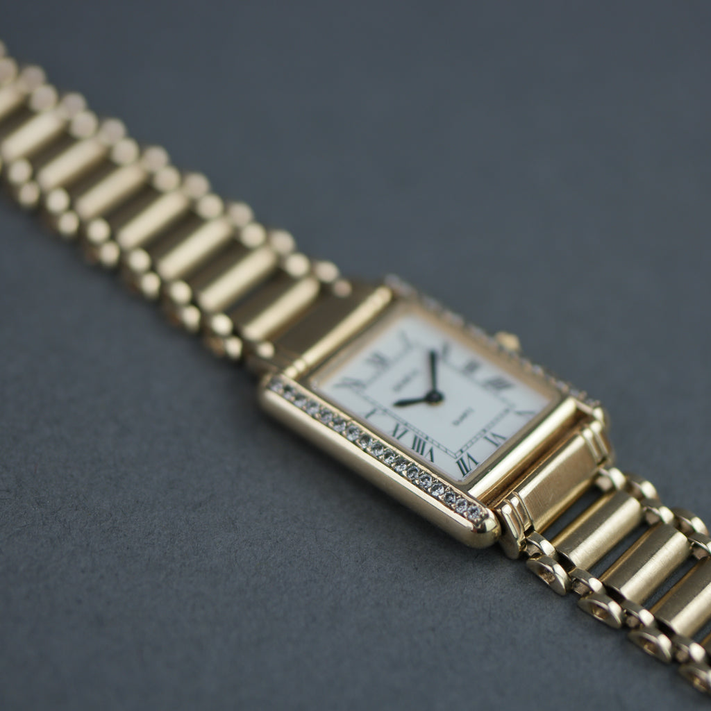 Geneve Ladies Solid 9ct Gold wristwatch - Diamond Bezel - Sapphire Crystal - Roman Dial - UK Hallmarked