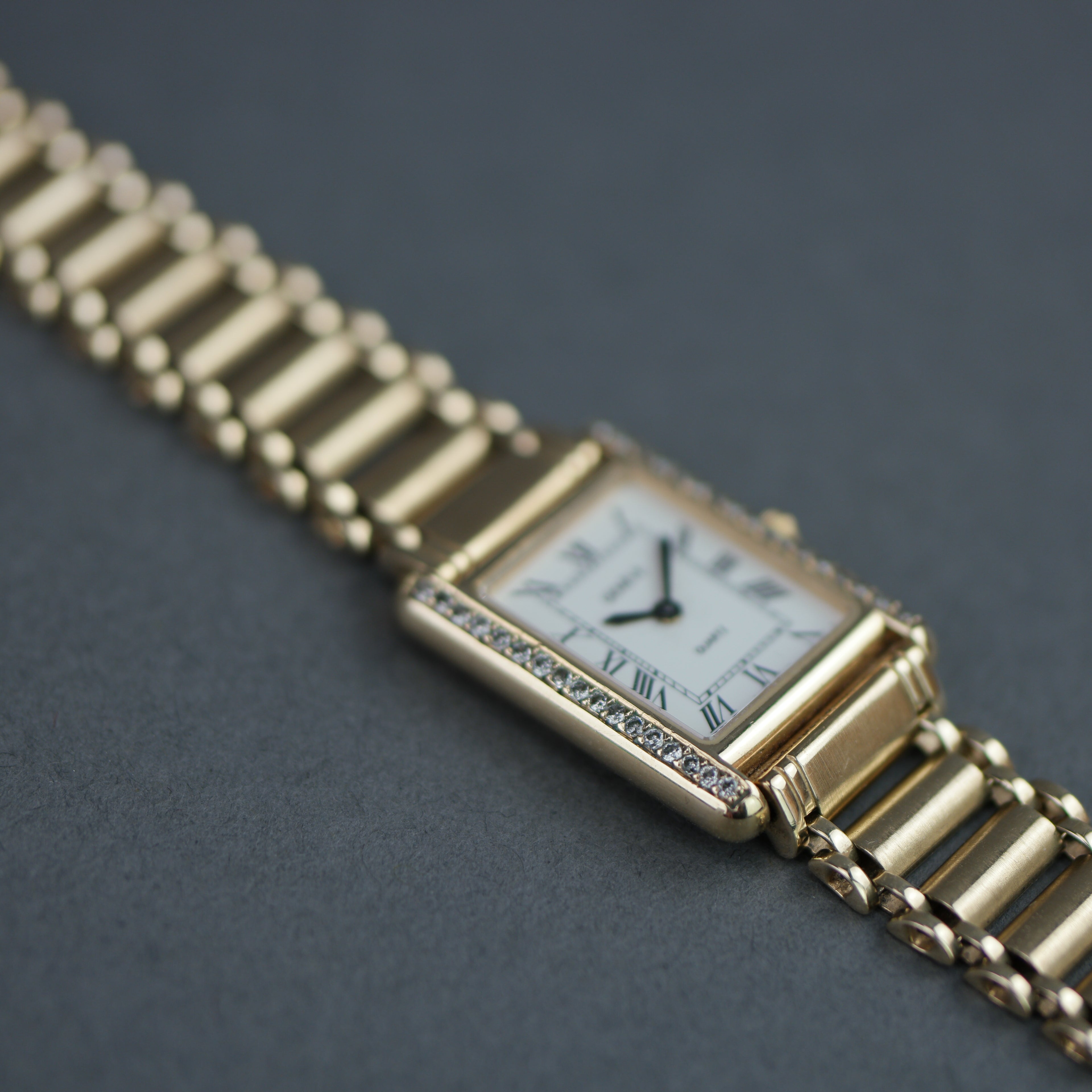 Geneve Ladies Solid 9ct Gold wristwatch - Diamond Bezel - Sapphire Crystal - Roman Dial - UK Hallmarked
