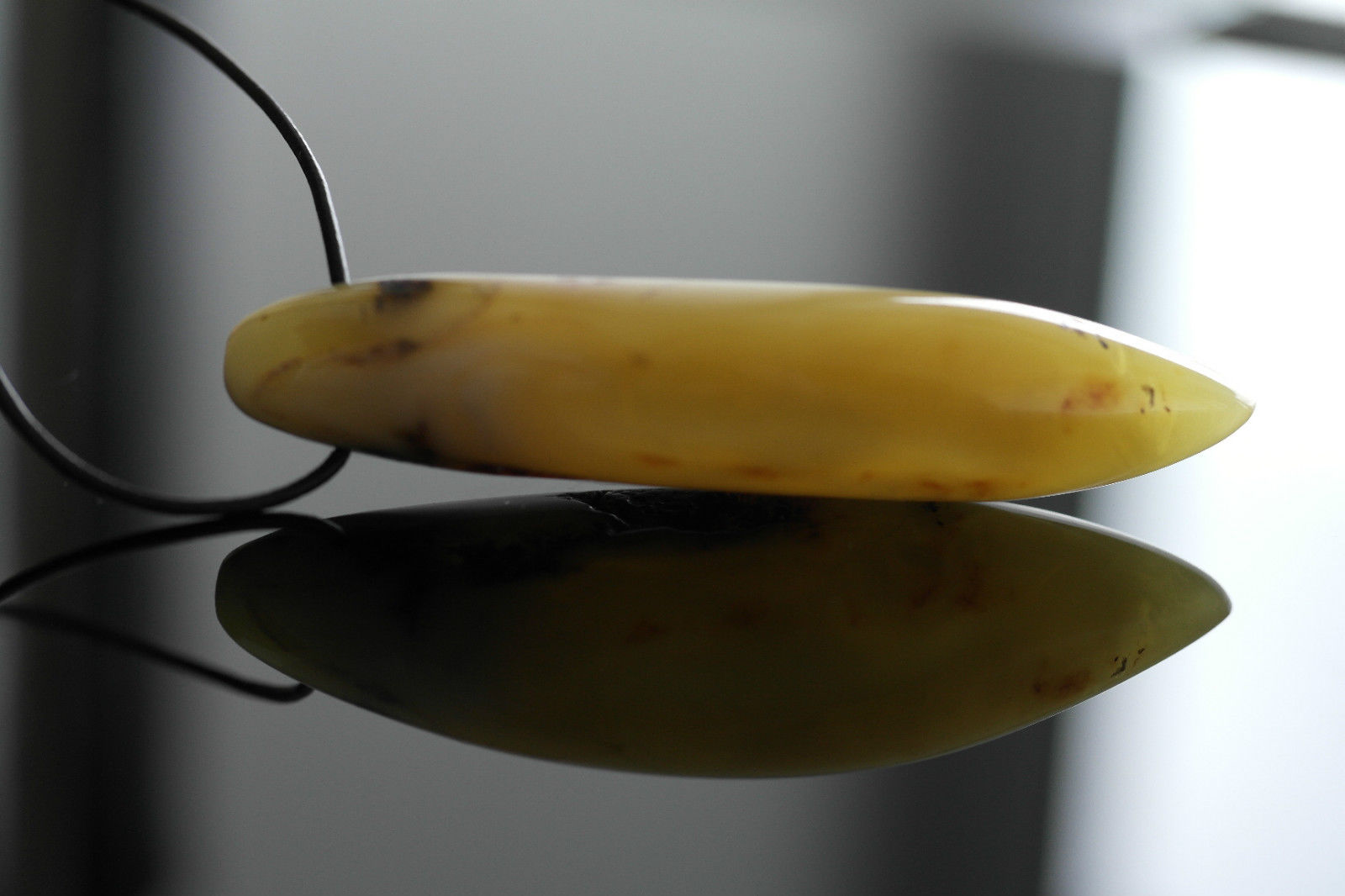 Genuine Baltic Amber handmade pendant on the rope