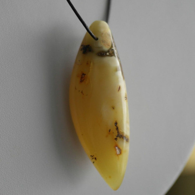 Genuine Baltic Amber handmade pendant on the rope