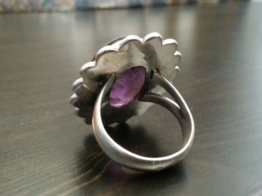 Stylish sterling silver ring with purple amethyst cabochon
