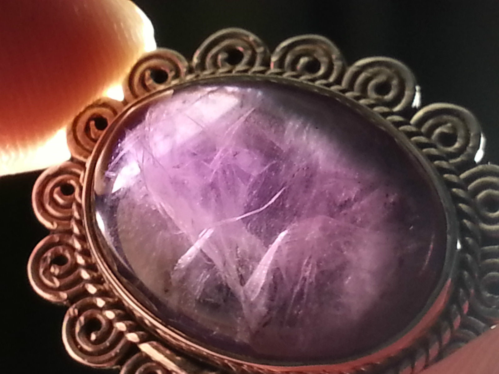 Stylish sterling silver ring with purple amethyst cabochon