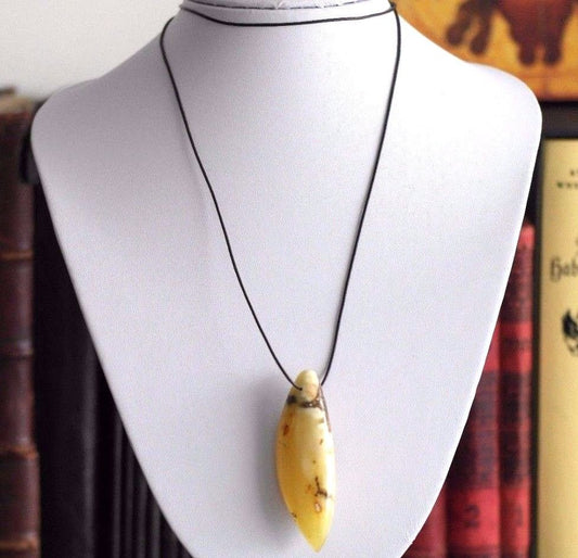 Genuine Baltic Amber handmade pendant on the rope