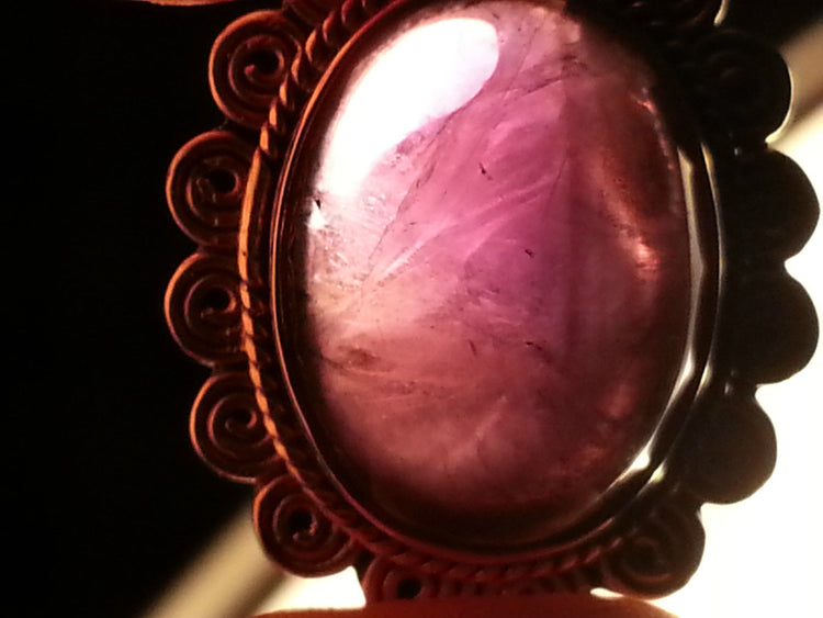 Stylish sterling silver ring with purple amethyst cabochon