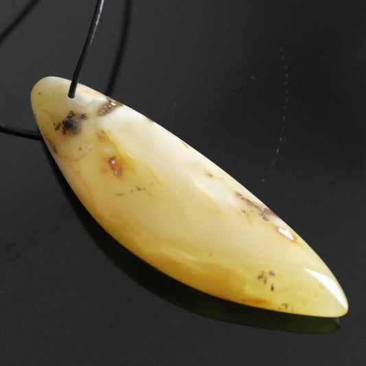 Genuine Baltic Amber handmade pendant on the rope