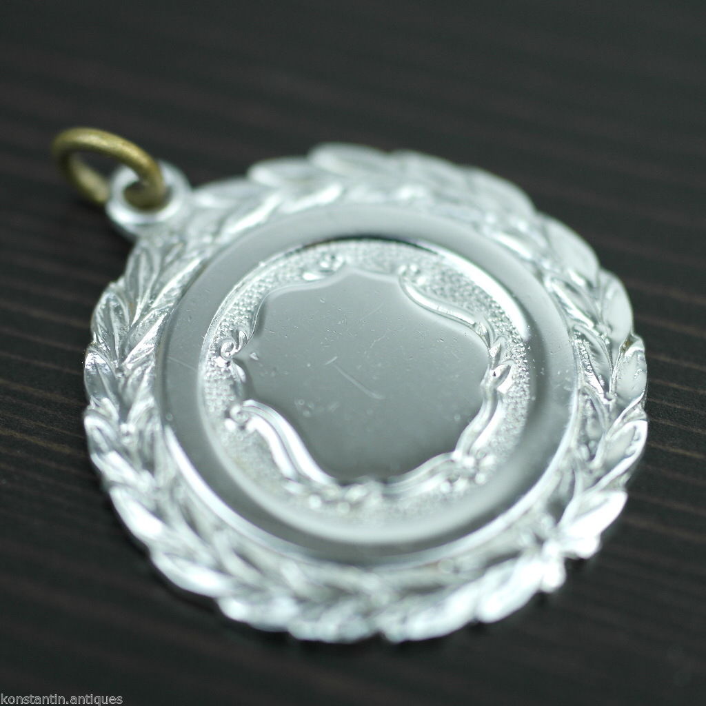 Vintage medal shield charm