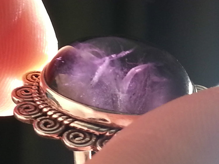 Stylish sterling silver ring with purple amethyst cabochon
