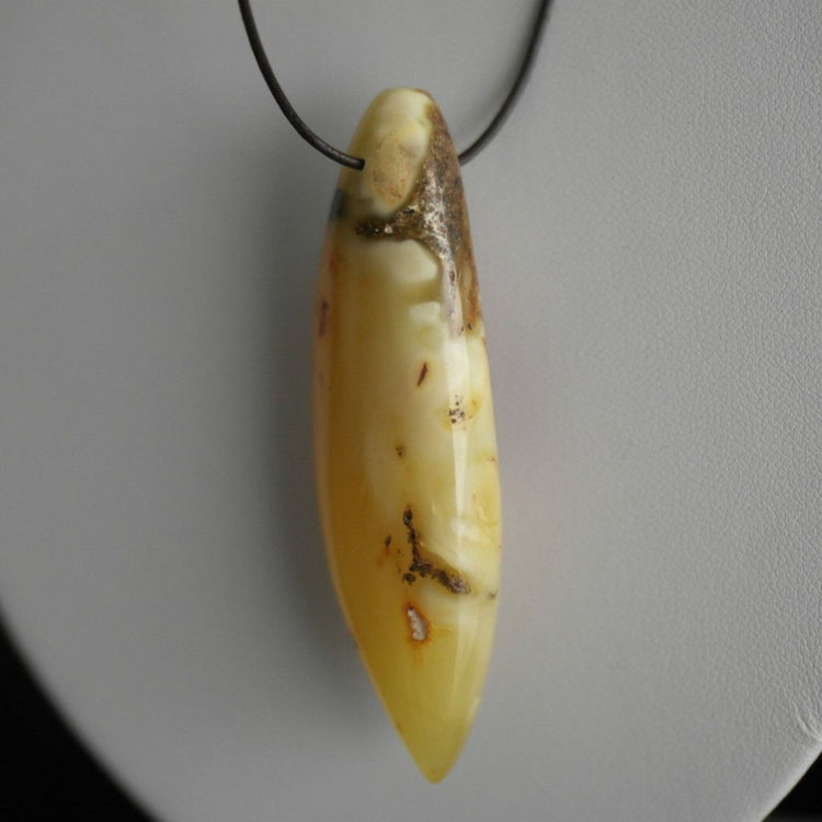 Genuine Baltic Amber handmade pendant on the rope