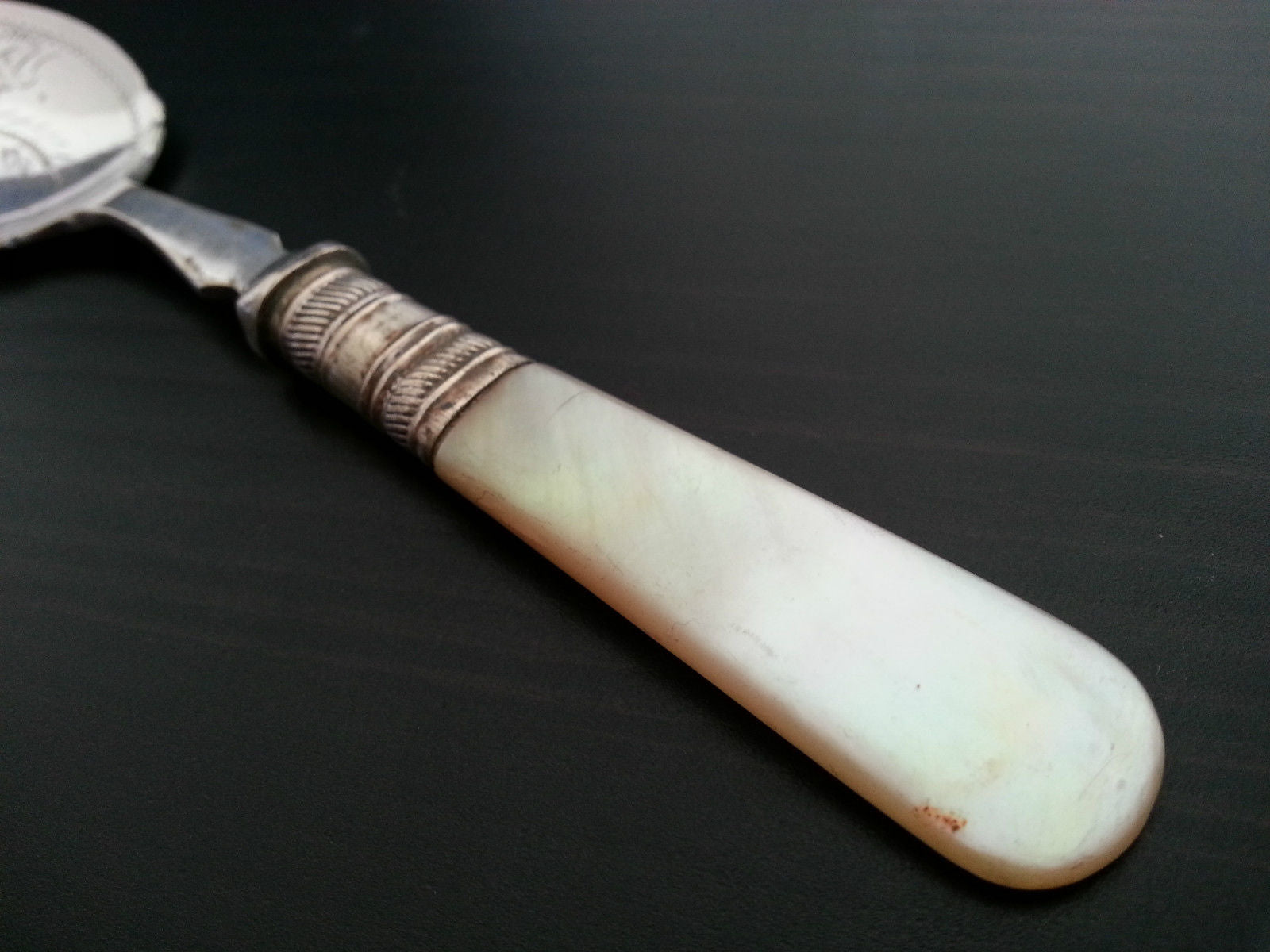 Antique ornamented desert silver plate spoon mother of pearl handle