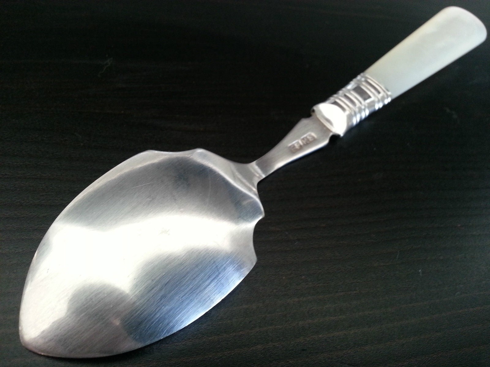 Antique silver plated dessert spoon ornamented with mother of pearl handle British Empire