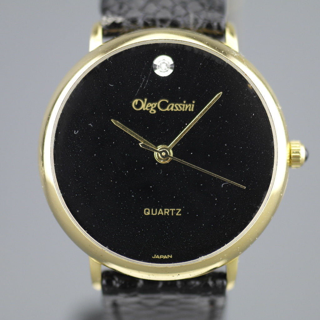 Elegant Oleg Cassini diamond gold plated case ladies wrist watch with black dial