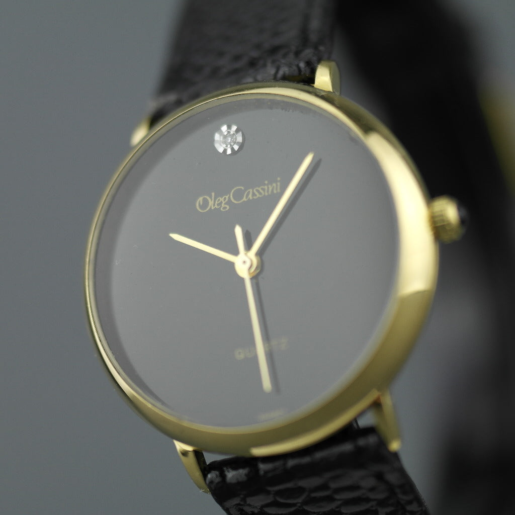 Elegant Oleg Cassini diamond gold plated case ladies wrist watch with black dial