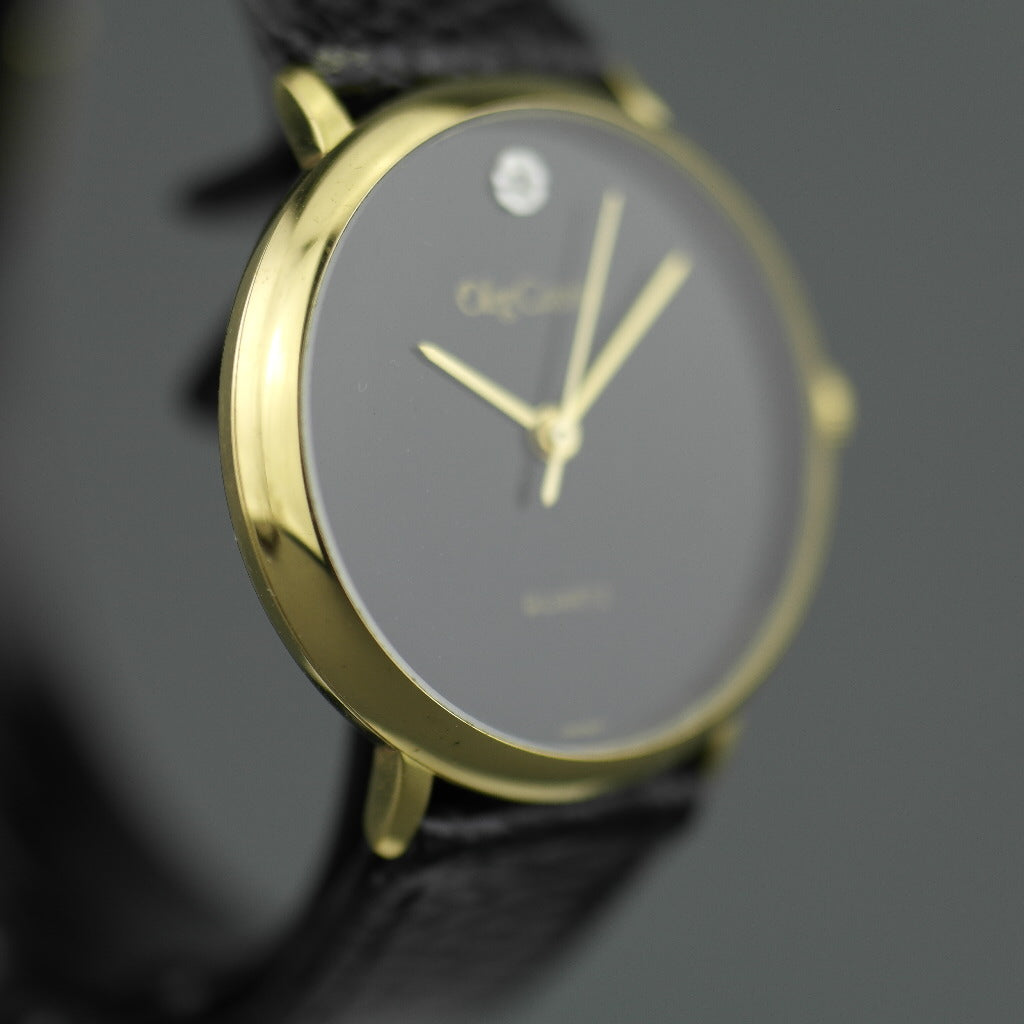 Elegant Oleg Cassini diamond gold plated case ladies wrist watch with black dial