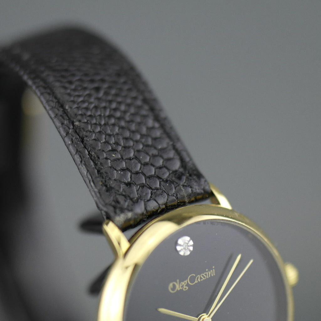 Elegant Oleg Cassini diamond gold plated case ladies wrist watch with black dial