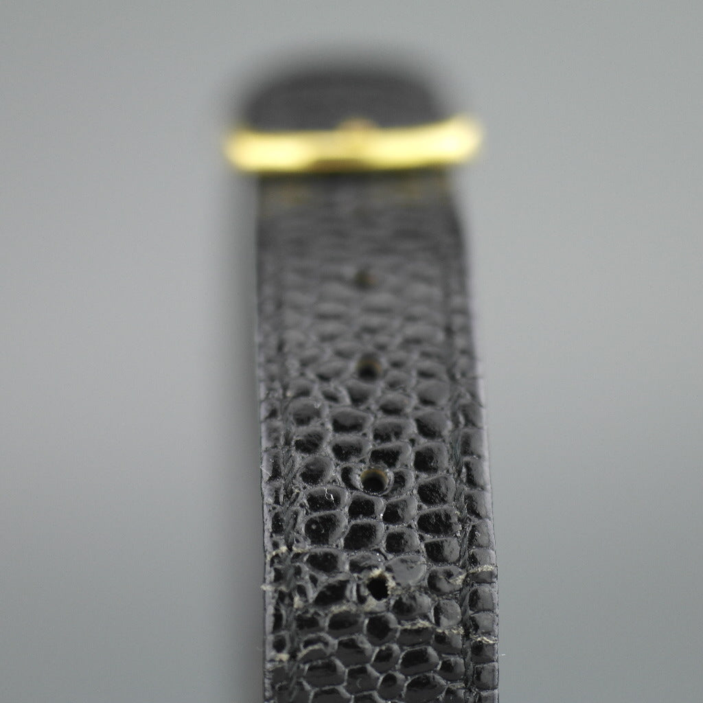 Elegante Oleg Cassini Damenarmbanduhr mit diamantvergoldetem Gehäuse und schwarzem Zifferblatt