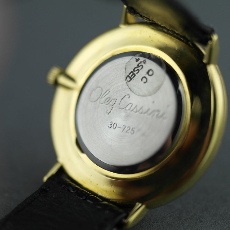 Elegant Oleg Cassini diamond gold plated case ladies wrist watch with black dial