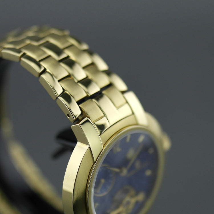 Reloj de pulsera mecánico Constantin Weisz chapado en oro con esfera azul y caja. 