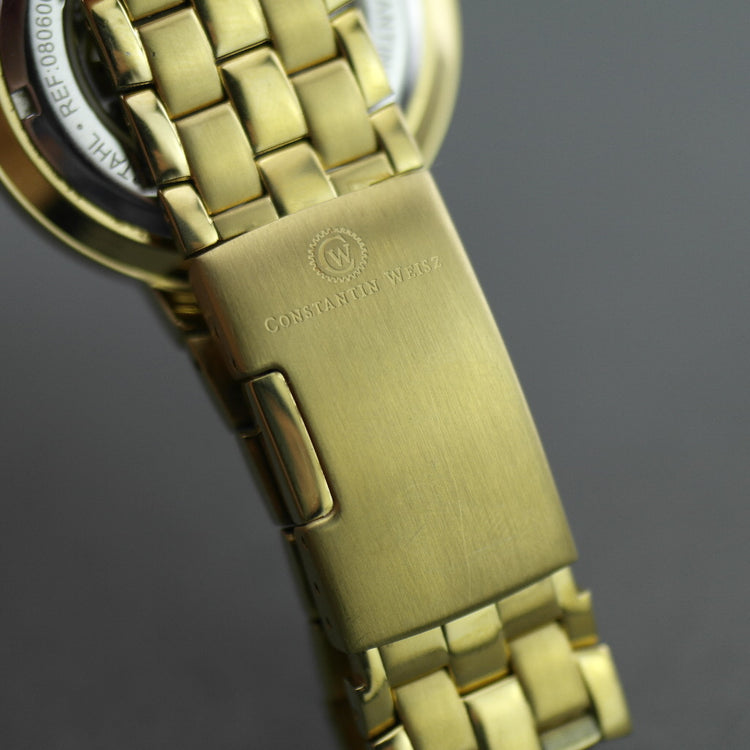 Reloj de pulsera mecánico Constantin Weisz chapado en oro con esfera azul y caja. 