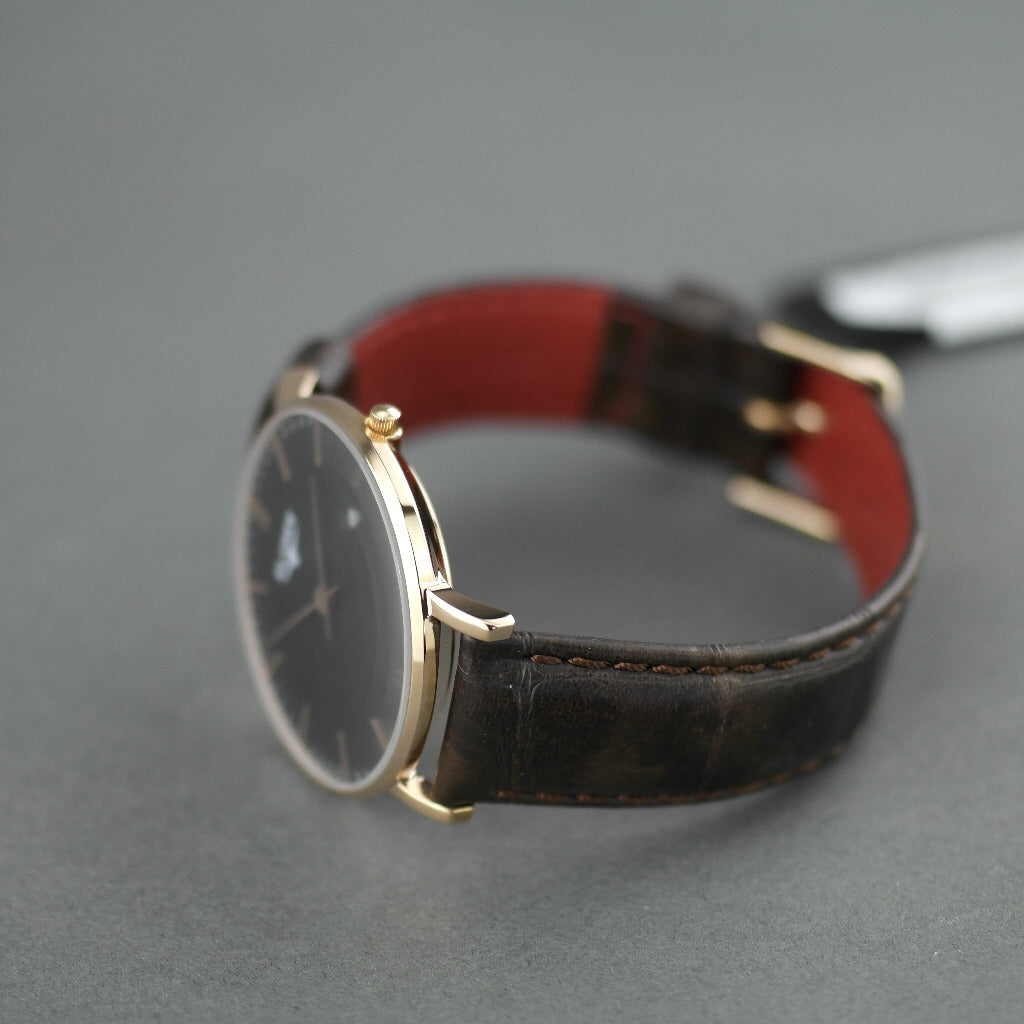 Zelos El elegante reloj plano de cuarzo chapado en oro de ELYSEE con fecha