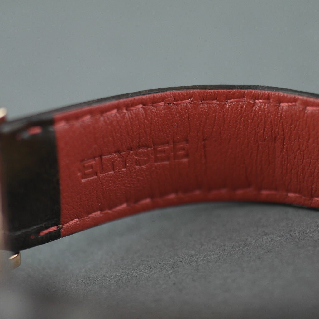 Zelos El elegante reloj plano de cuarzo chapado en oro de ELYSEE con fecha