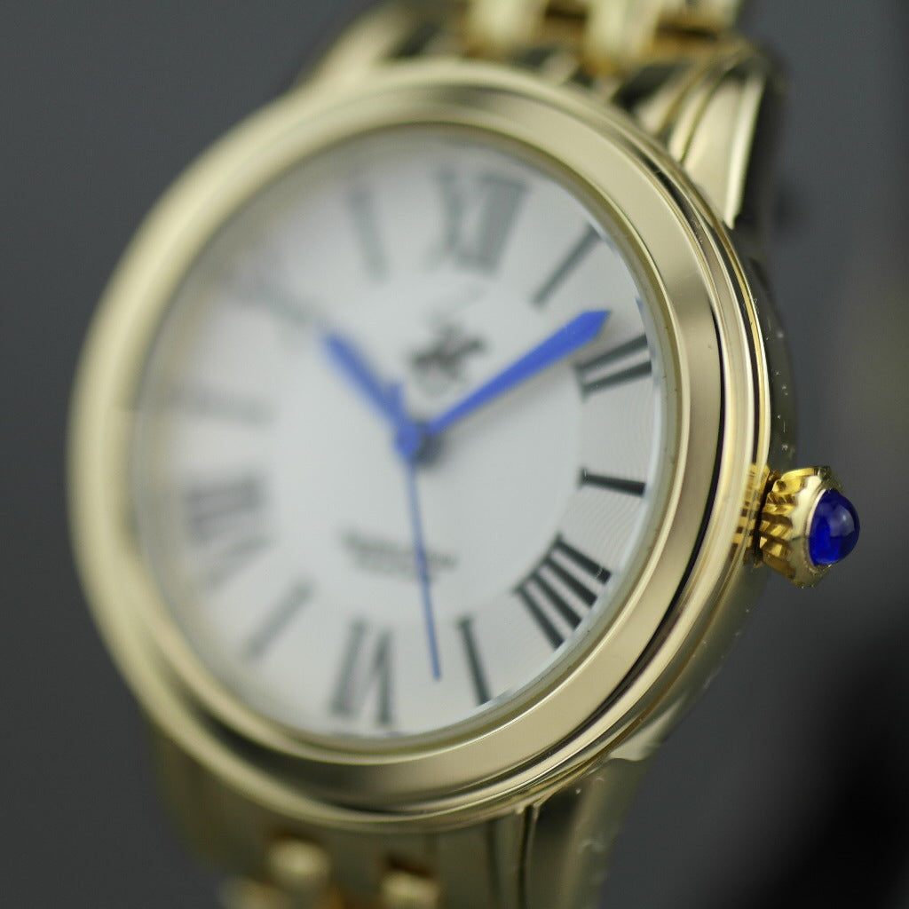 Beverly Hills Polo Club gold plated wristwatch with Roman numerals and blue hands