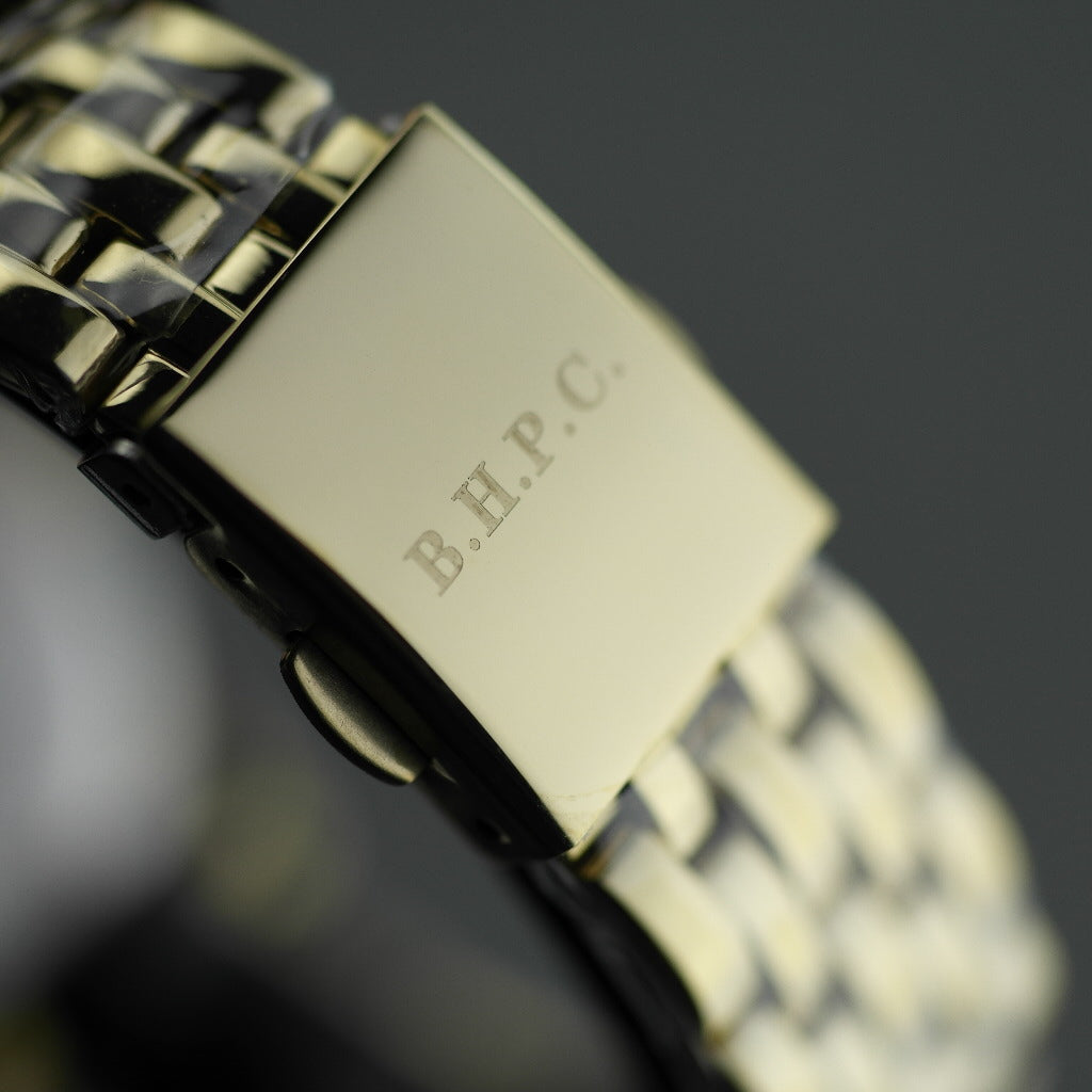 Beverly Hills Polo Club gold plated wristwatch with Roman numerals and blue hands