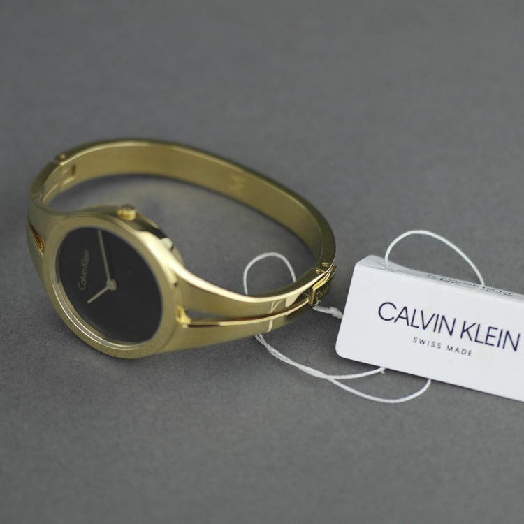 Calvin Klein Addict Damenuhr mit vergoldetem Armreif und schwarzem Zifferblatt 
