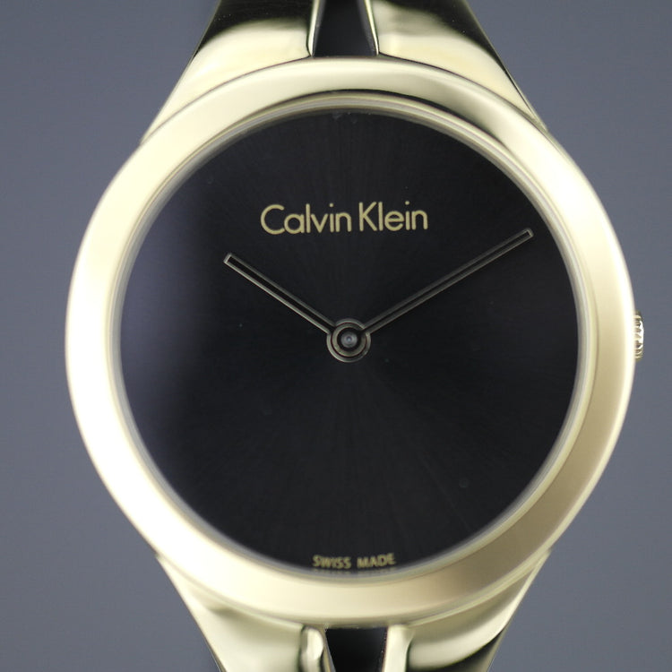 Calvin Klein Addict Reloj para mujer con brazalete chapado en oro y esfera negra 