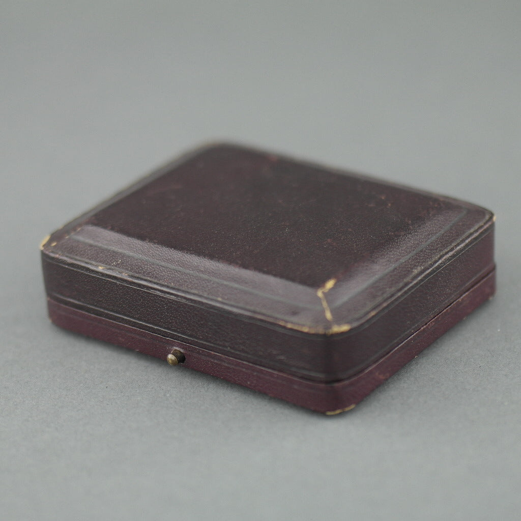 Caja de cuero antiguo marrón para juego de gemelos y tachuelas