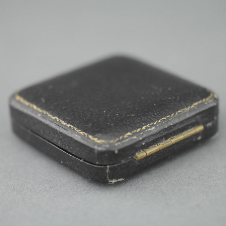 Caja negra antigua para monedas de 32 mm de ancho fabricada en el Imperio Británico