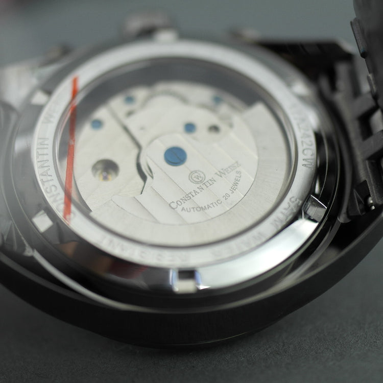 Constantin Weisz Herren-Armbanduhr mit automatischem Tachymeter und offenem Herzen