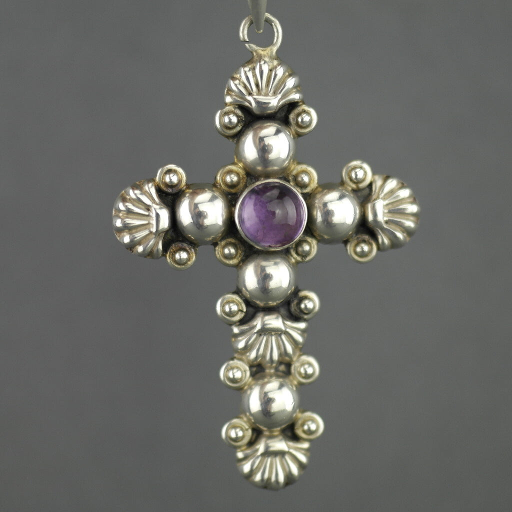 Vintage sterling silver cross pendant with amethyst cabochon stone