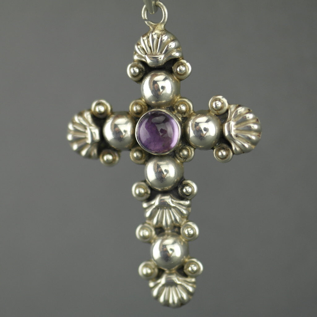 Vintage sterling silver cross pendant with amethyst cabochon stone