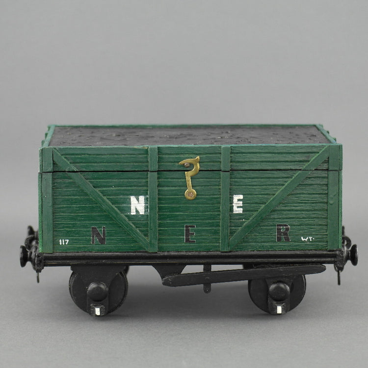 Vintage secret wooden box in shape of a train wagon full of coal