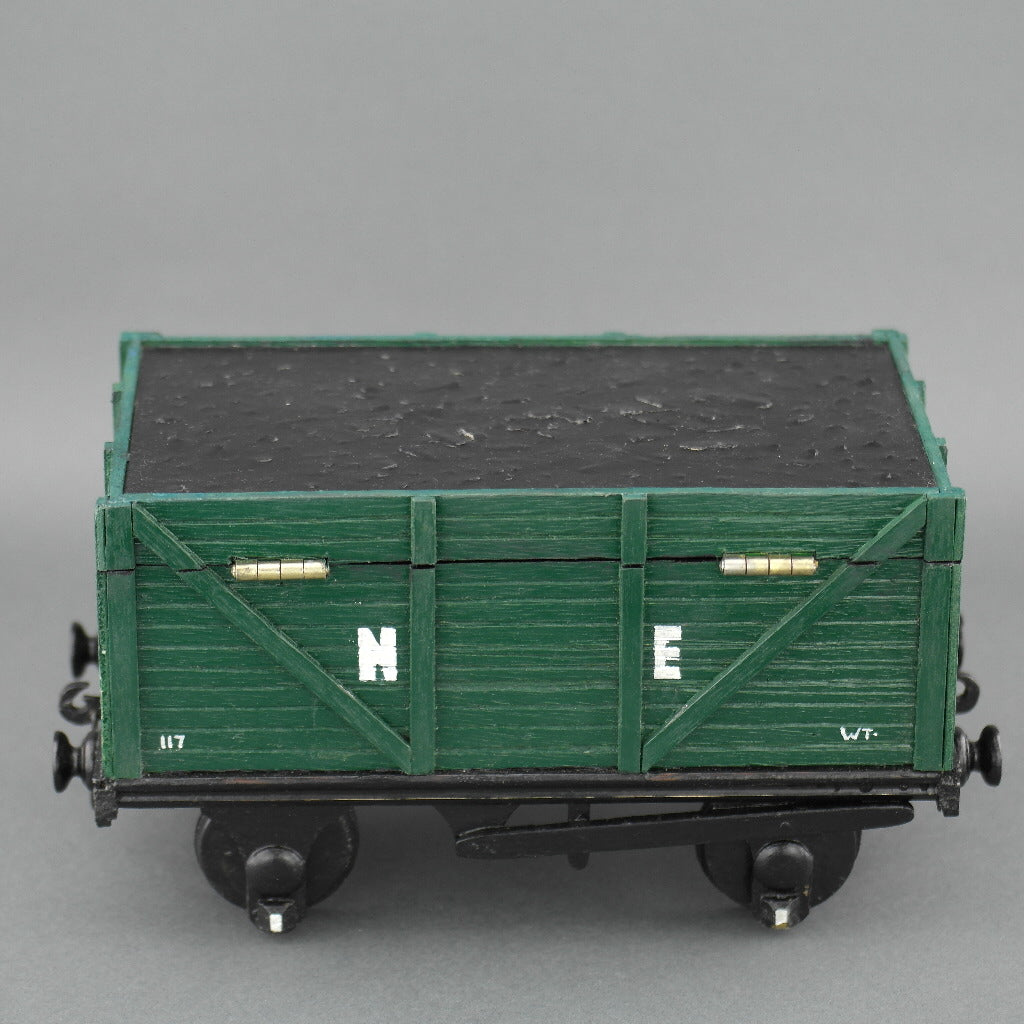 Vintage secret wooden box in shape of a train wagon full of coal