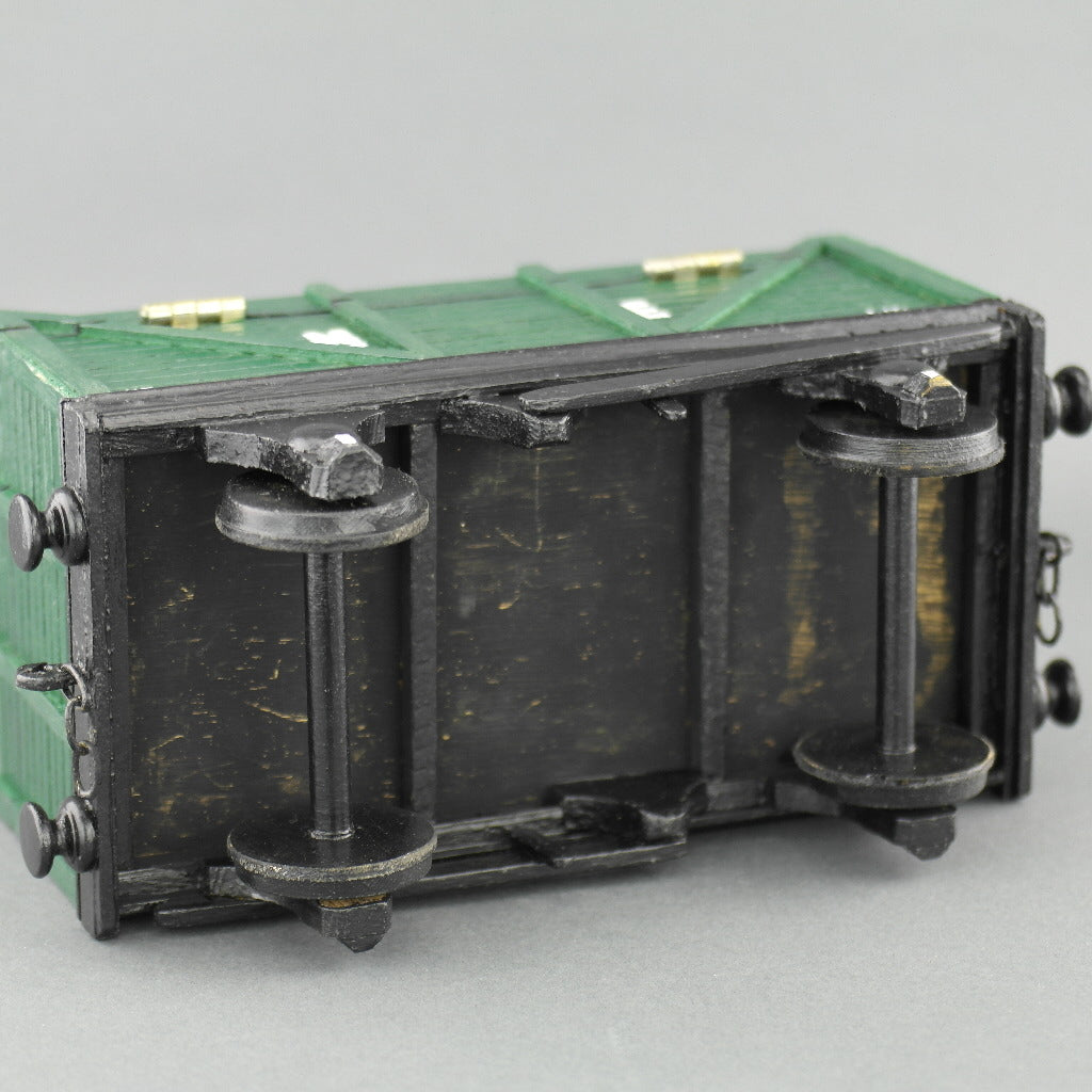 Vintage secret wooden box in shape of a train wagon full of coal