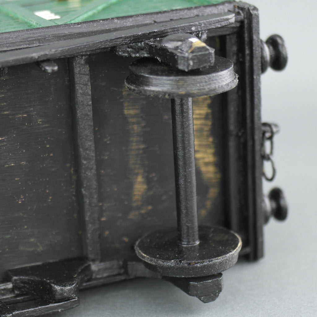 Vintage secret wooden box in shape of a train wagon full of coal
