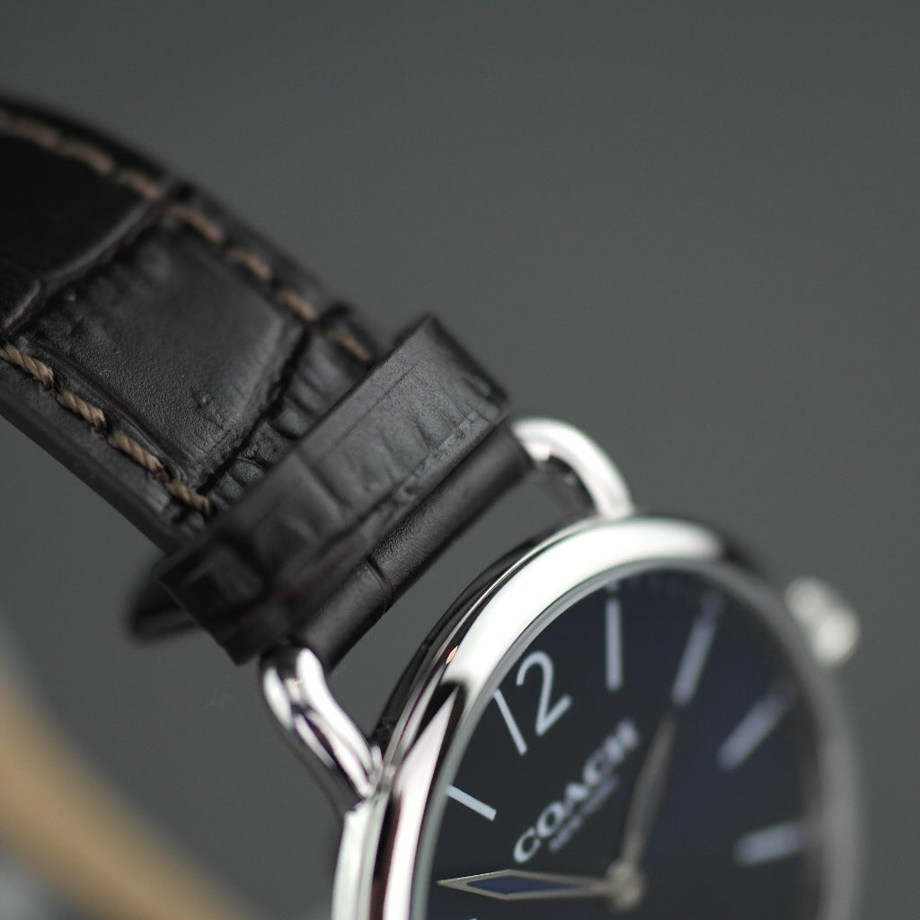 Reloj clásico Coach azul y marrón de la colección Delancey