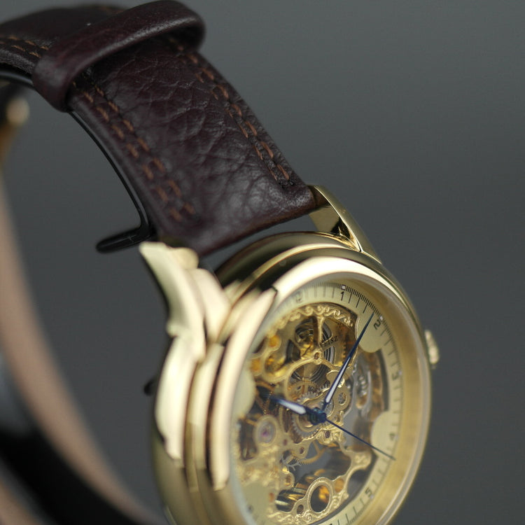 Constantin Weisz Reloj de pulsera mecánico chapado en oro con esfera esquelética y correa de cuero