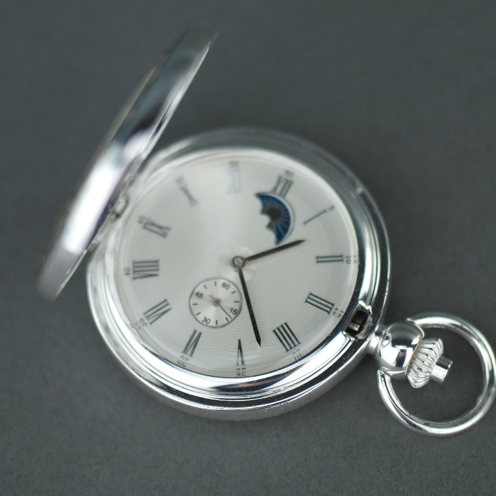 Silver plated pocket watch with Roman numbers and day and night indicator