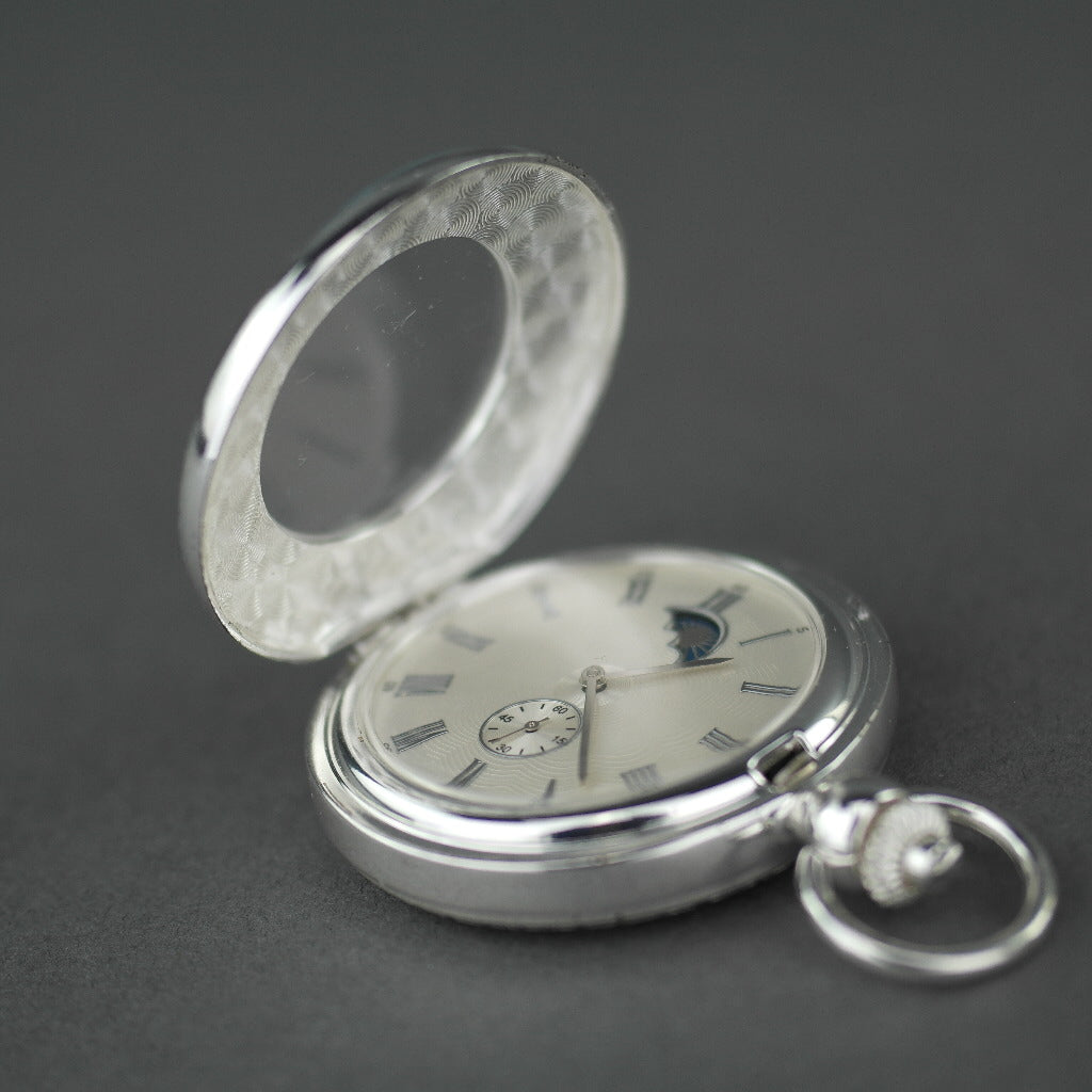 Silver plated pocket watch with Roman numbers and day and night indicator