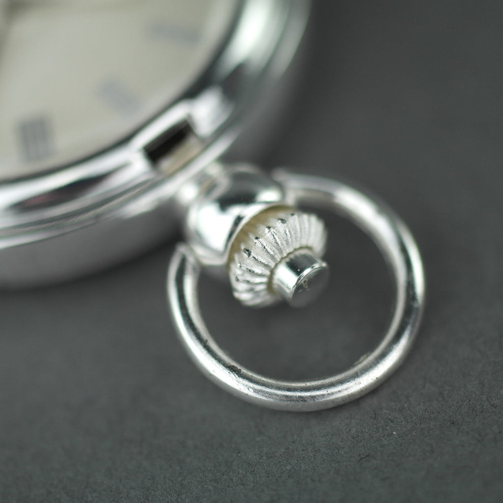Silver plated pocket watch with Roman numbers and day and night indicator