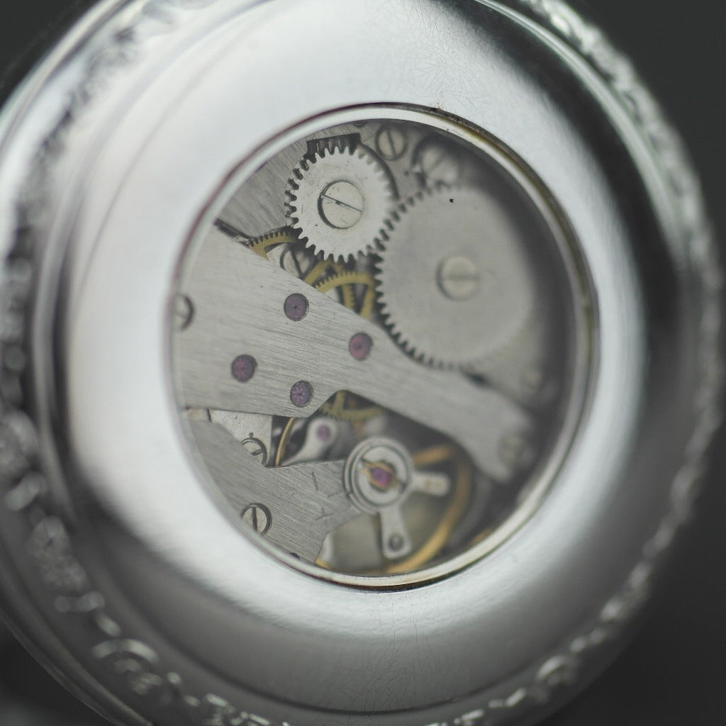 Silver plated pocket watch with Roman numbers and day and night indicator