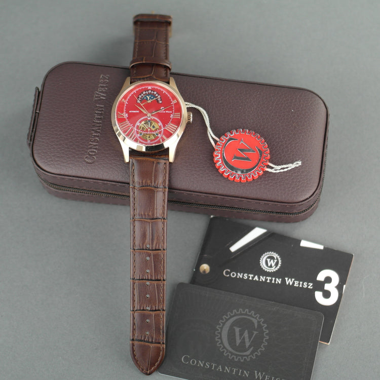 Constantin Weisz Reloj de pulsera automático para caballero chapado en oro con esfera roja y correa marrón