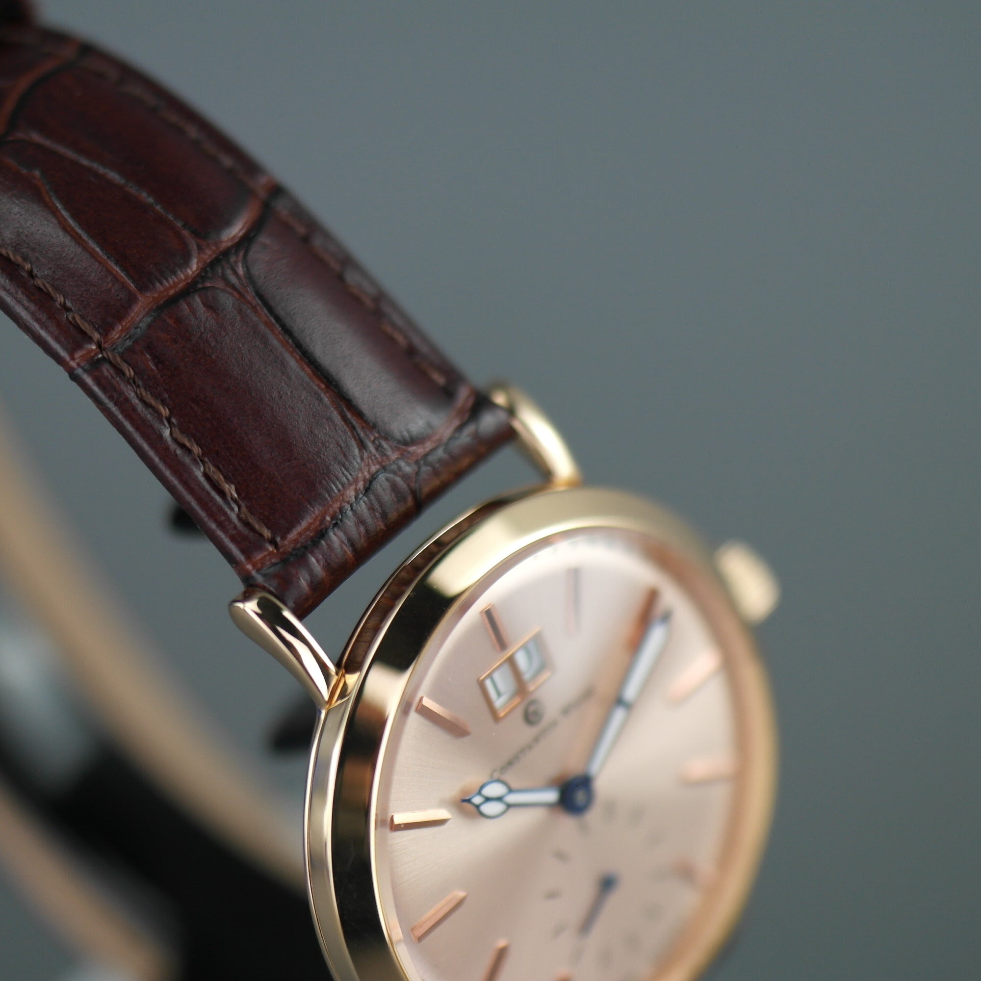 Constantin Weisz Gold plated mechanical wrist watch with brown leather strap