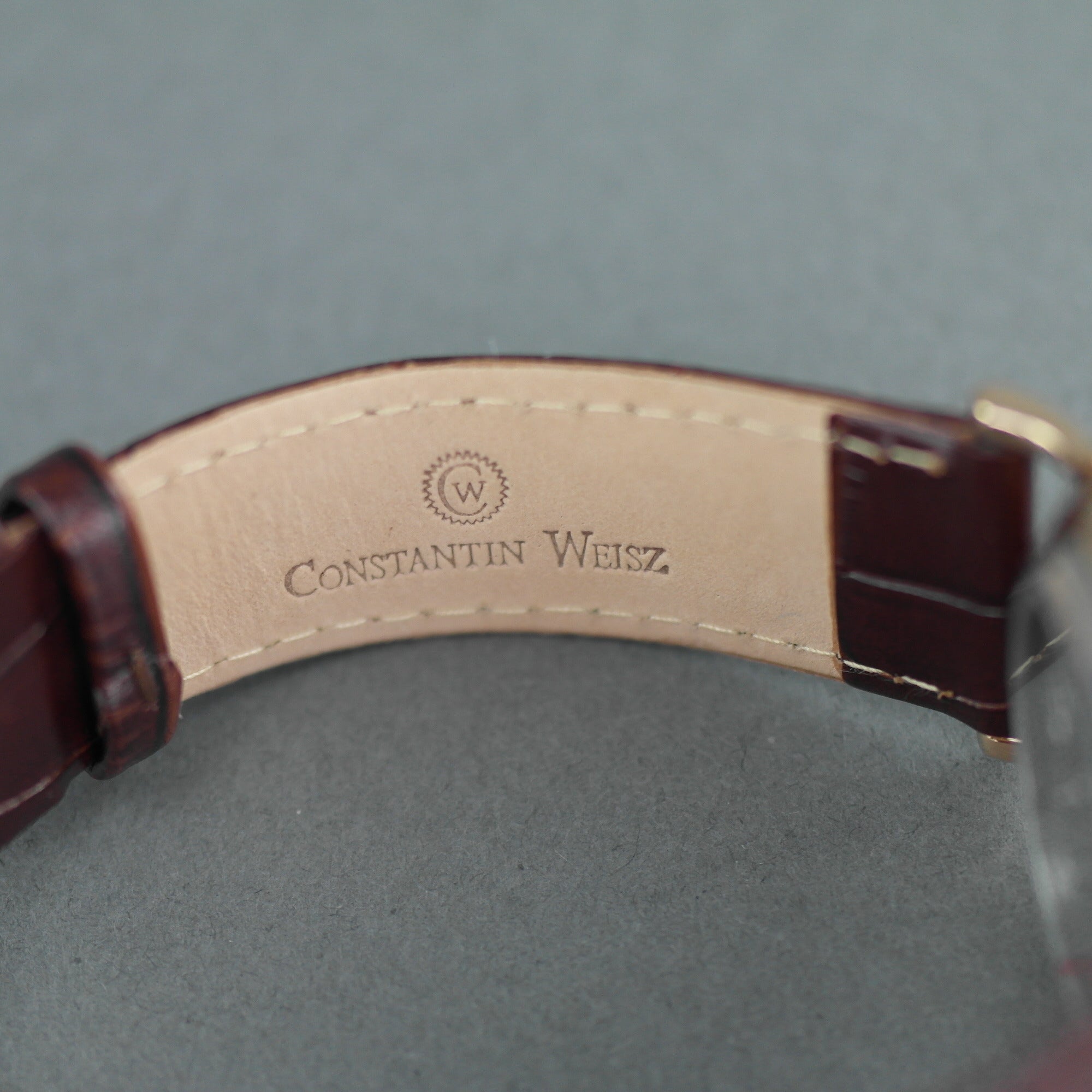 Constantin Weisz Gold plated mechanical wrist watch with brown leather strap