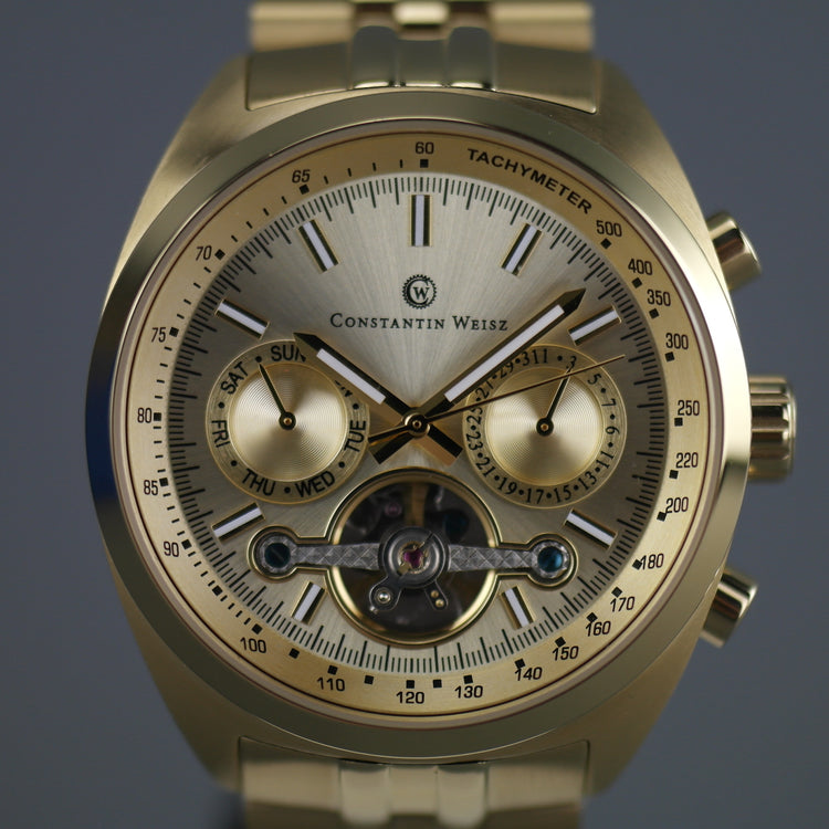 Constantin Weisz Gold plated Automatic Tachymeter Open heart wrist watch with bracelet