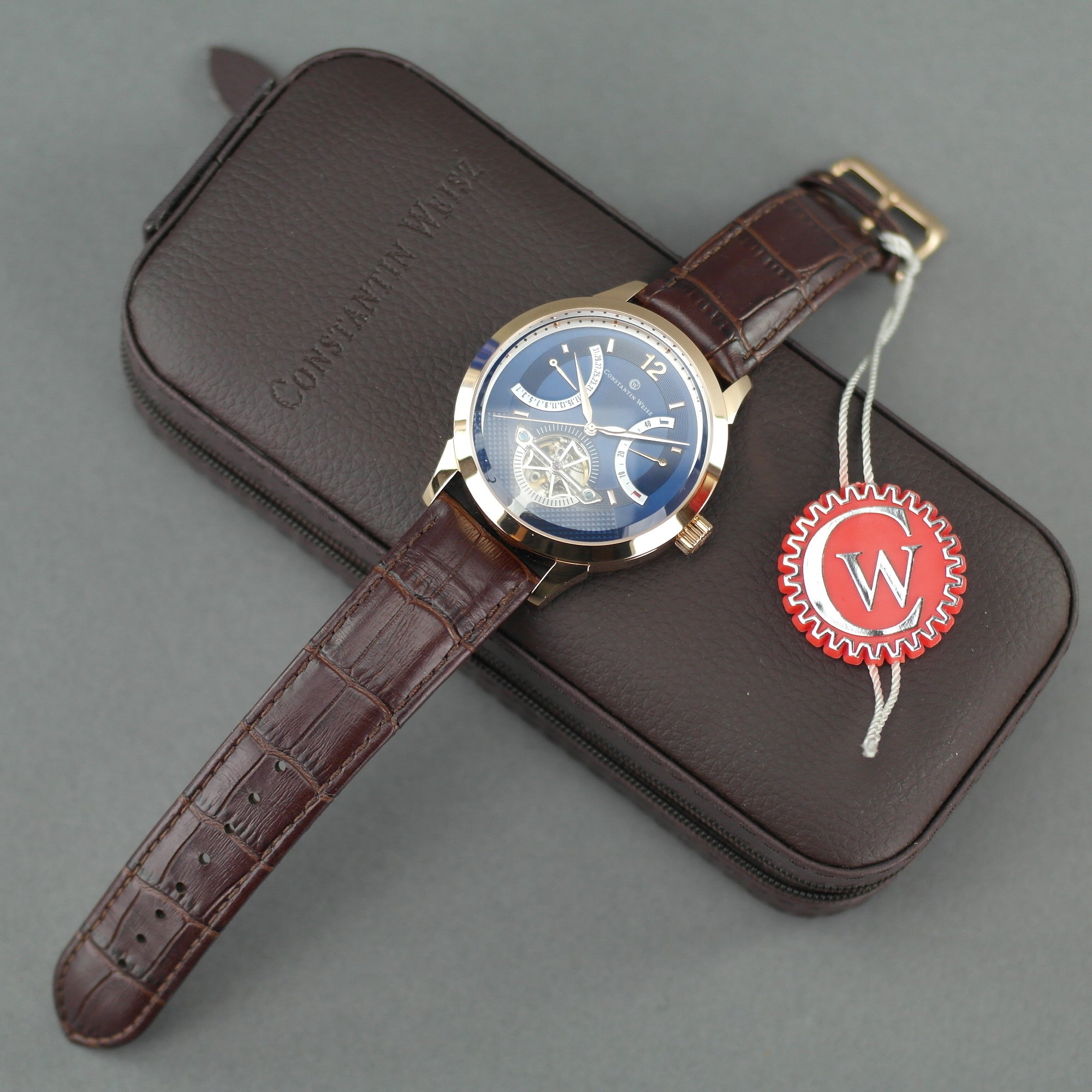 Constantin Weisz Vergoldete Automatik-Armbanduhr mit 38 Steinen und offenem Herzwerk, Lederarmband