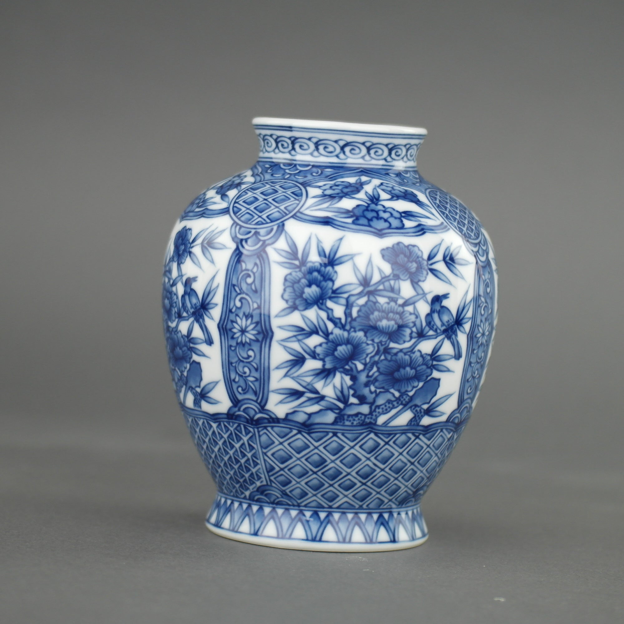 Oriental blue flowers vase "Dragon Peak" by the Sanyo Porcelain Company